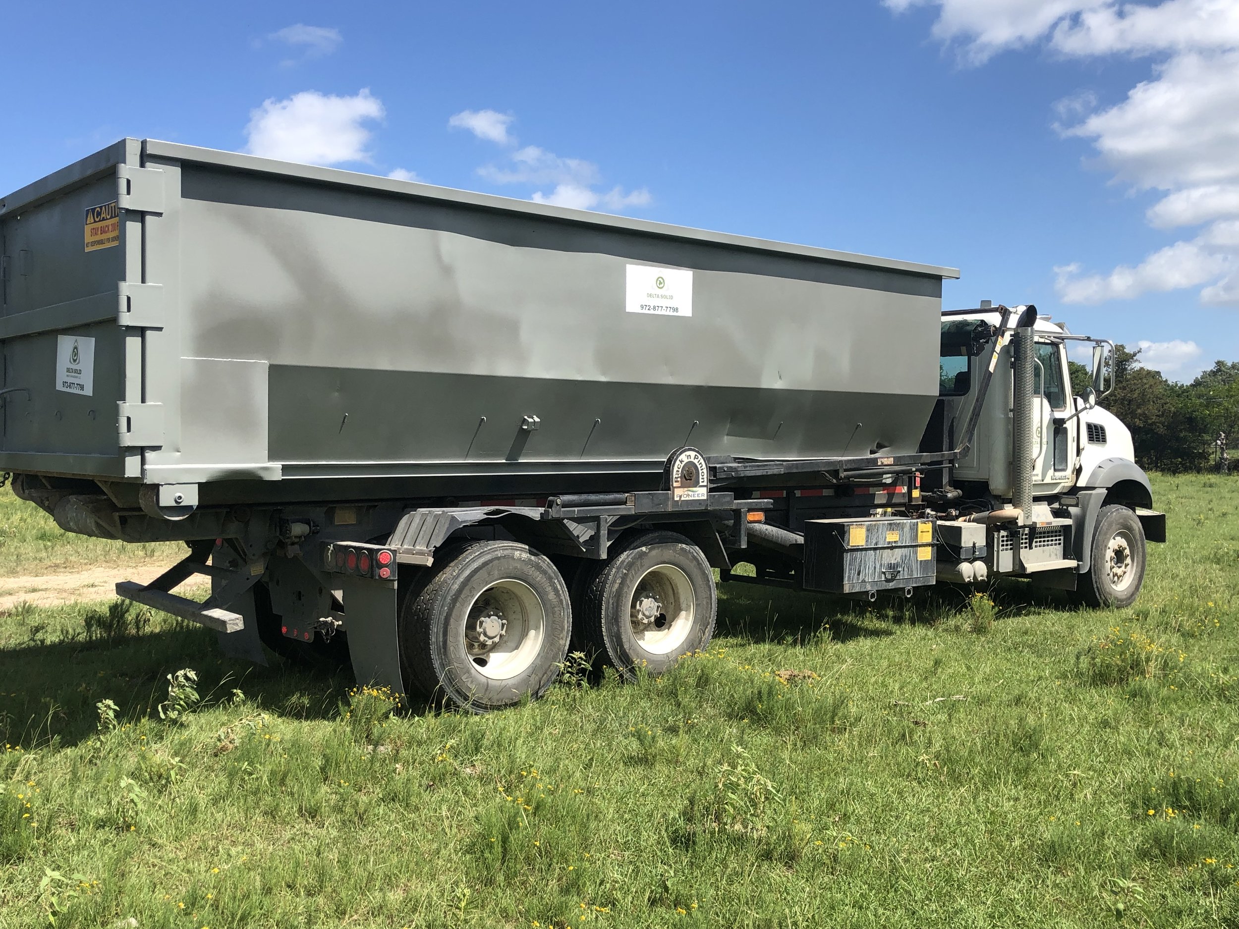 Truck with dumpster