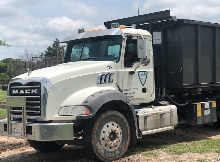 Truck with dumpster